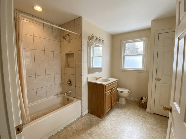 Bathroom Remodel before — original condition prior to tub-to-shower conversion in Bellingham, MA