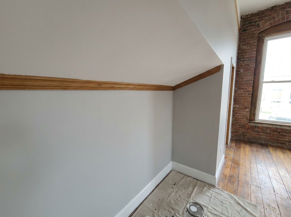 Repaired and repainted commercial ceiling in an older New England building