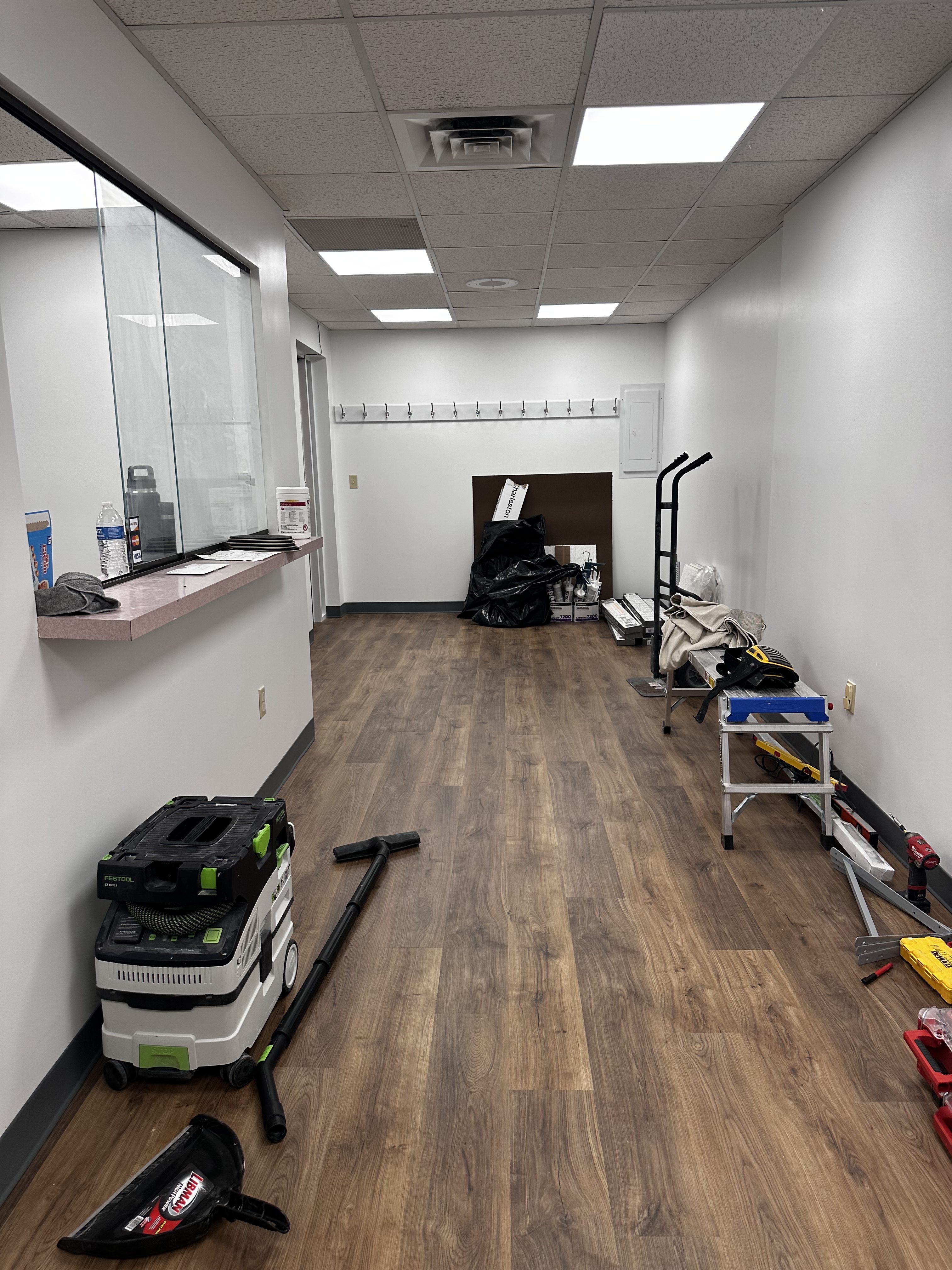 Commercial office renovation in Worcester, MA - LVP flooring, wallpaper removal, skim coating, and painting by JP Creative Maintenance (9)