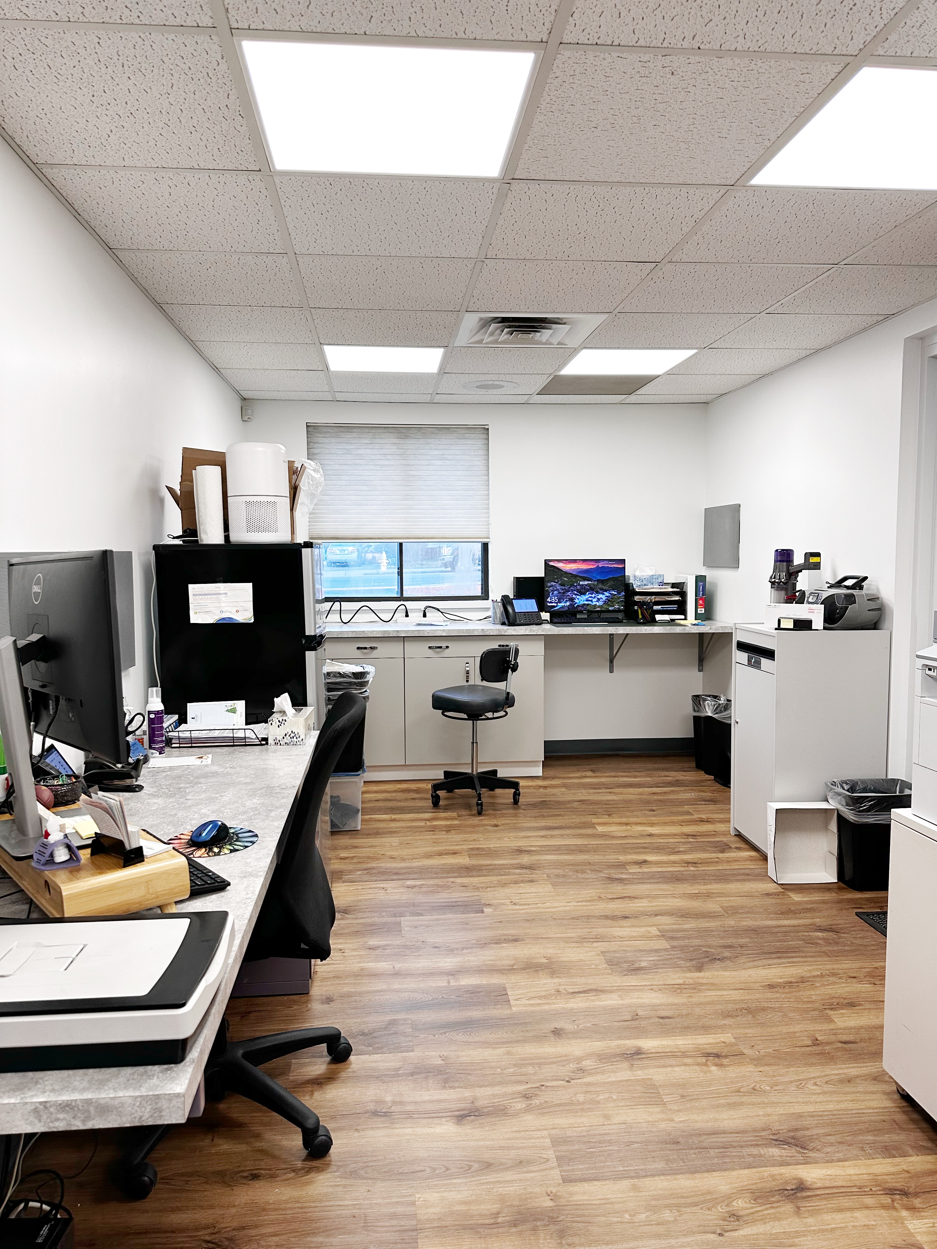 Commercial office renovation in Worcester, MA - LVP flooring, wallpaper removal, skim coating, and painting by JP Creative Maintenance (12)