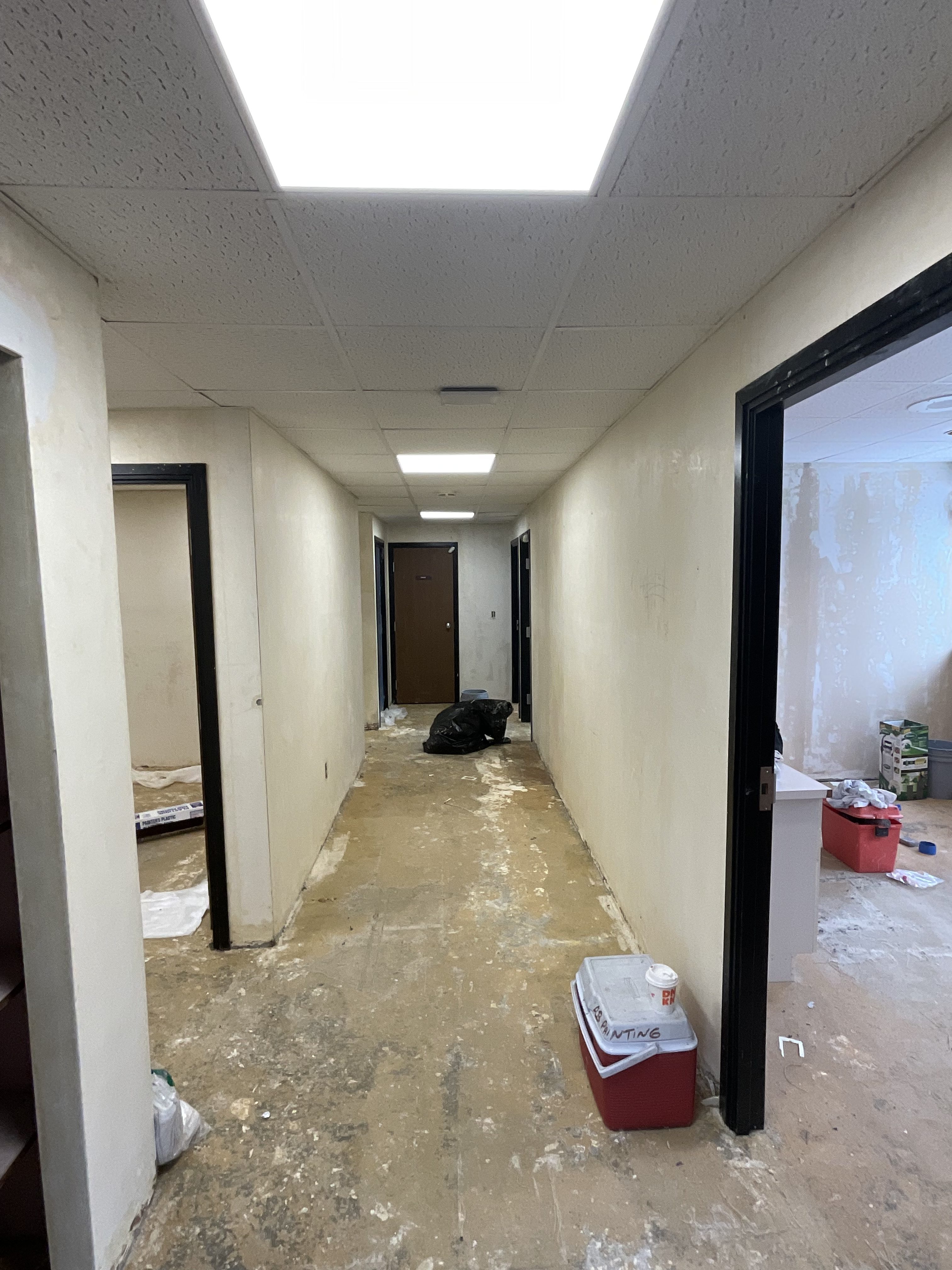 Commercial office renovation in Worcester, MA - LVP flooring, wallpaper removal, skim coating, and painting by JP Creative Maintenance (2)