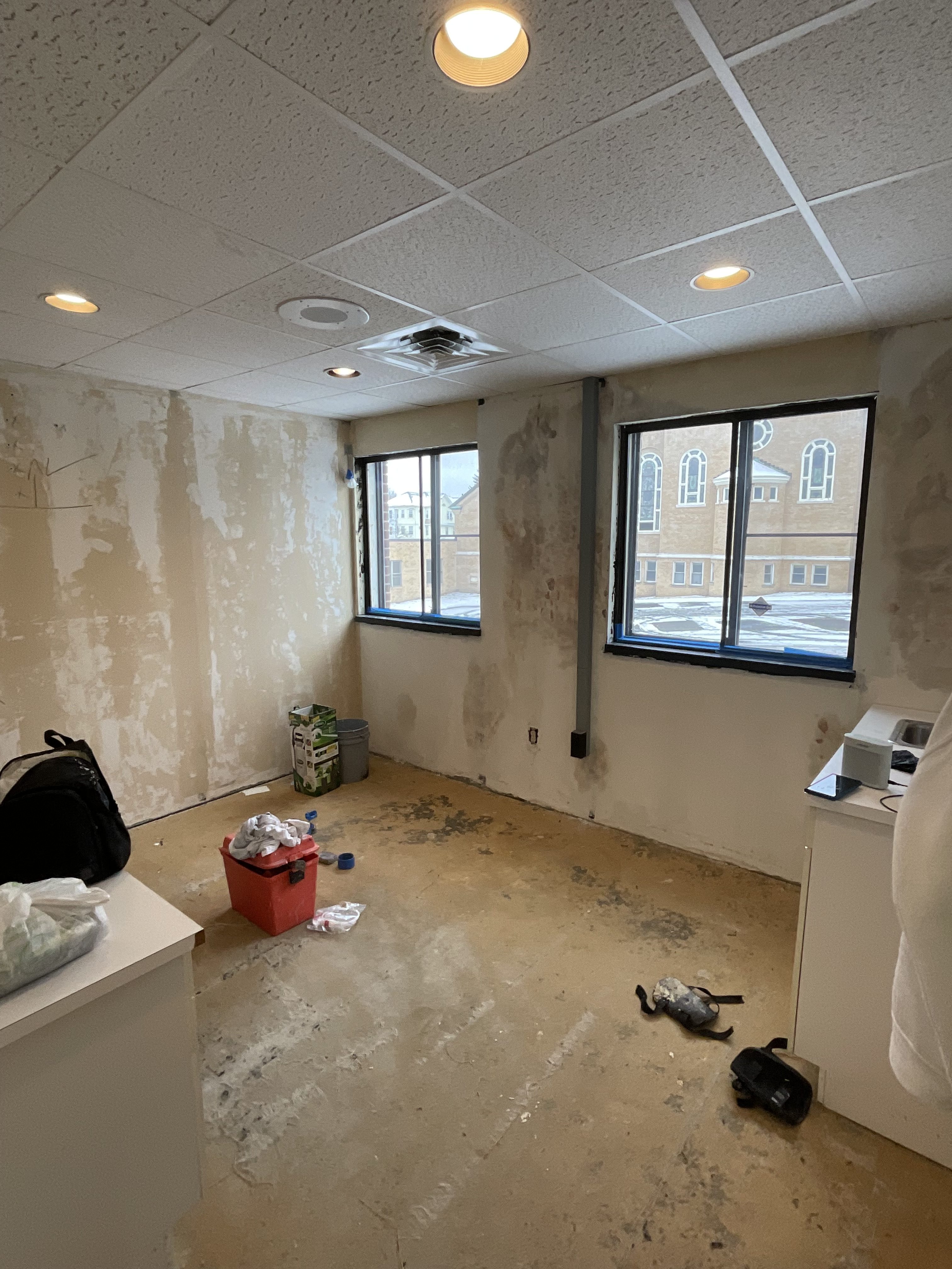 Commercial office renovation in Worcester, MA - LVP flooring, wallpaper removal, skim coating, and painting by JP Creative Maintenance (3)