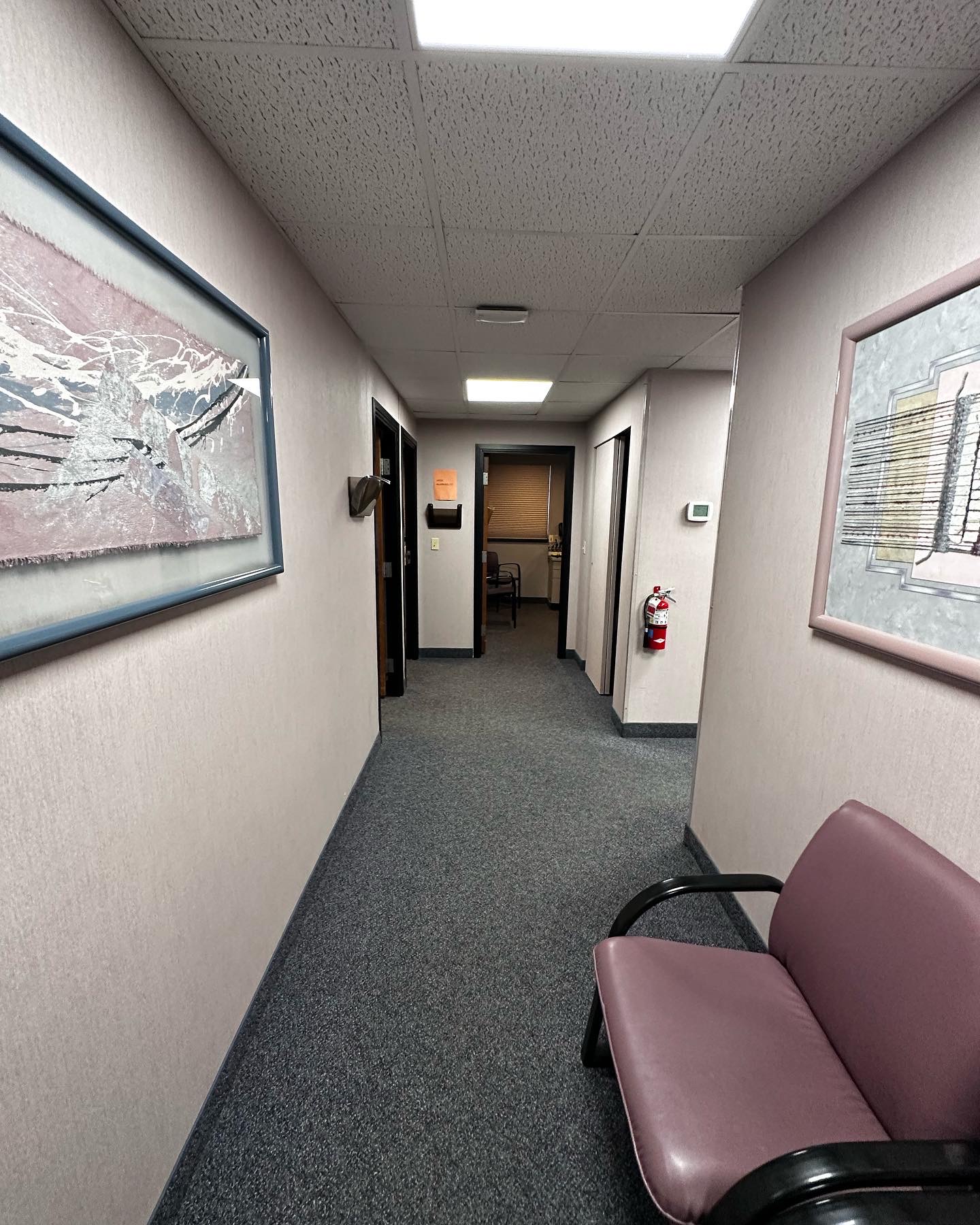 Commercial office renovation in Worcester, MA - LVP flooring, wallpaper removal, skim coating, and painting by JP Creative Maintenance (5)