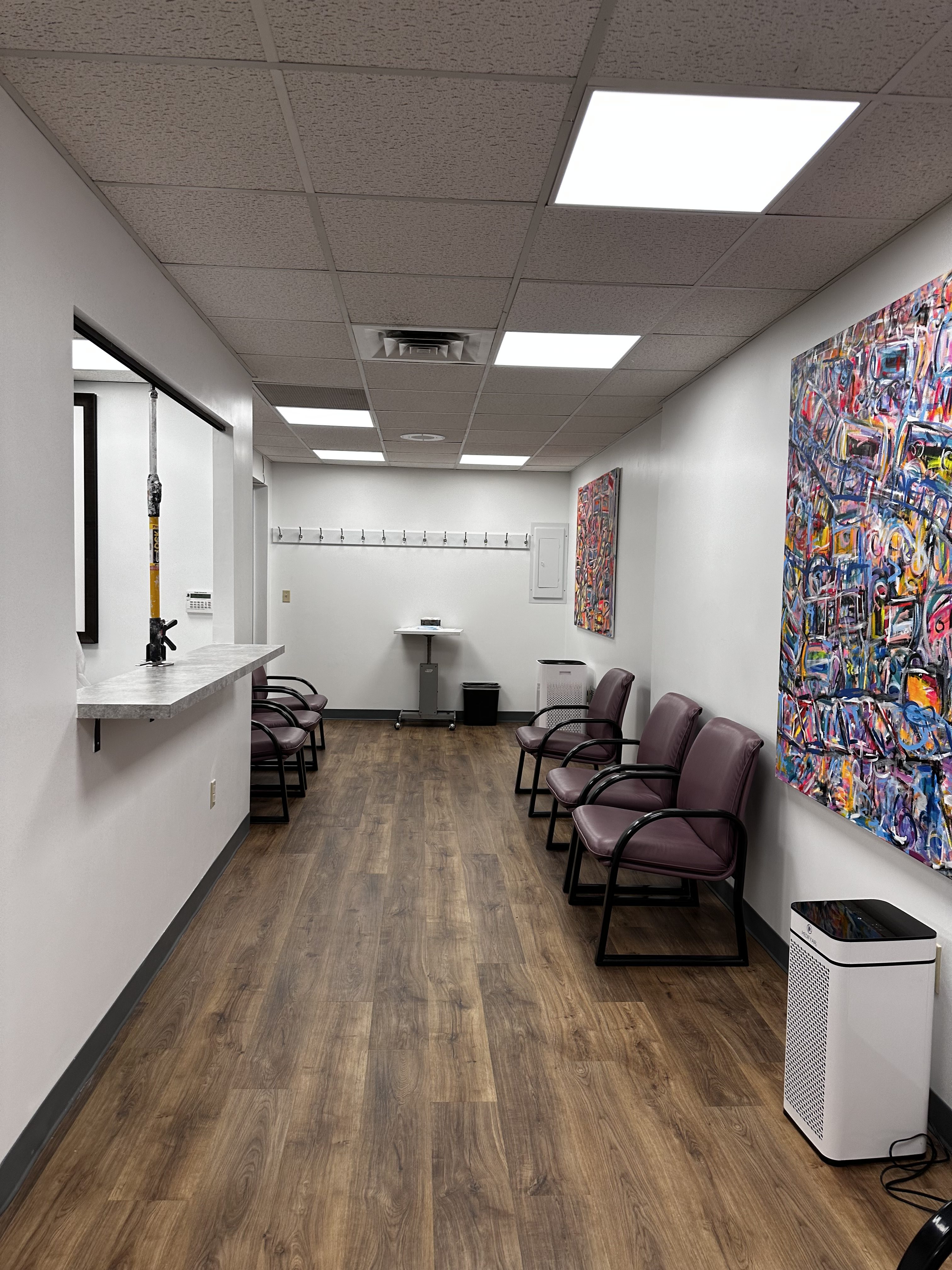 Commercial office renovation in Worcester, MA - LVP flooring, wallpaper removal, skim coating, and painting by JP Creative Maintenance (10)
