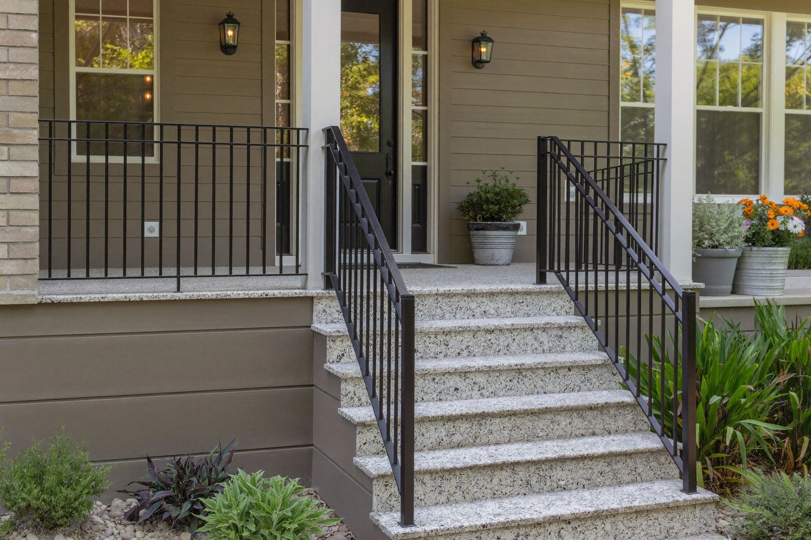 Rebuilt front steps with granite treads and new black iron railings