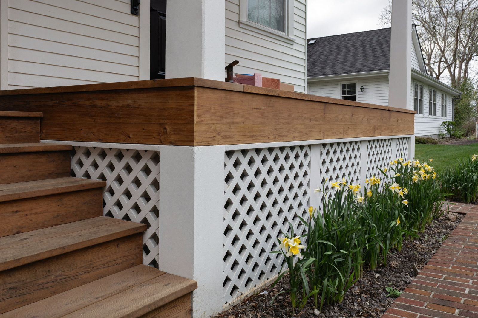 New porch steps and lattice skirt on an older New England home