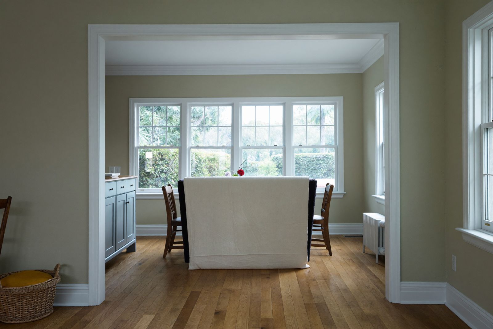 Freshly painted living room with white trim in a Colonial home