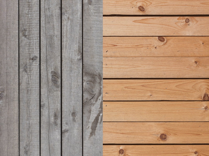 Honest repair detail: weathered grey porch boards with surface rot beside newly installed clear cedar replacements, crisp new carpentry against aged wood