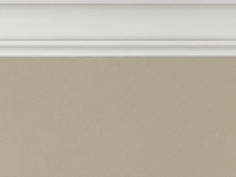 A razor-sharp paint line where a warm greige wall meets bright white crown molding at the top of the wall, the edge perfectly straight and clean