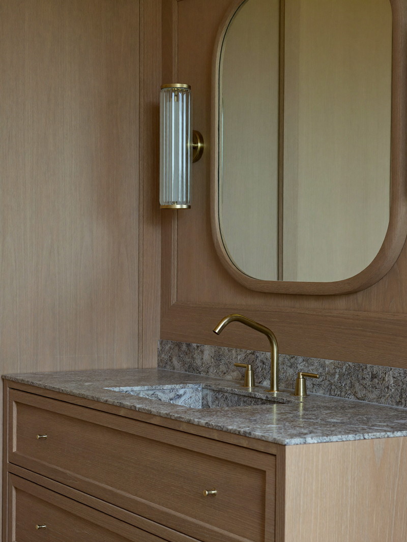 Oxblood lacquered vanity with antique mirror and alabaster sconce