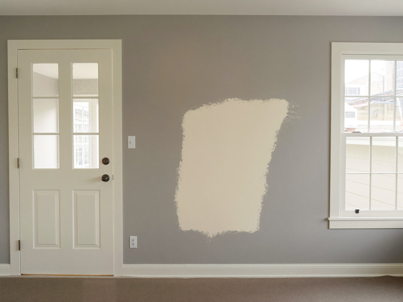 Drywall patch primed and blended beside door trim — illustrative imagery