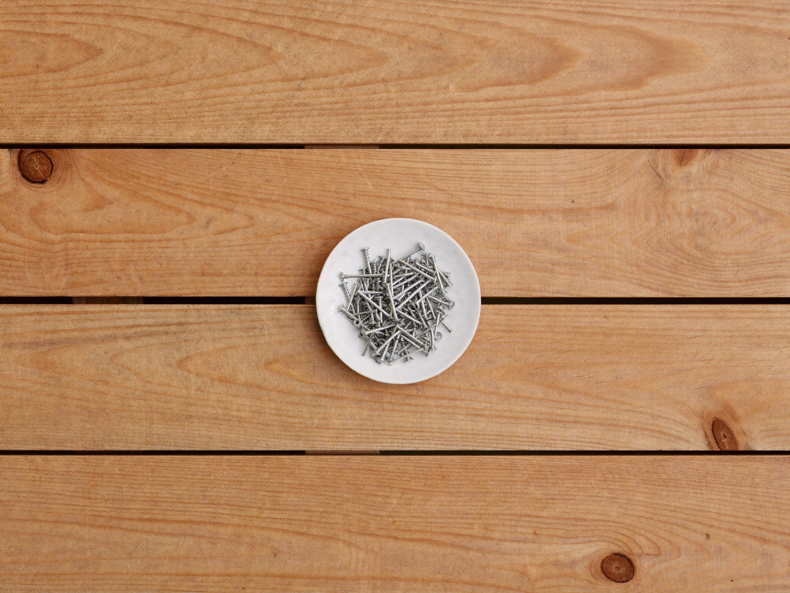 Overhead view of fresh cedar decking boards with visible natural wood grain laid side by side