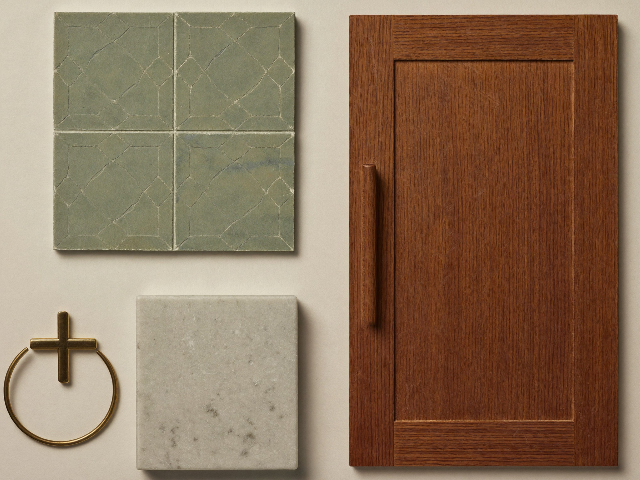 Bathroom material samples — sage handmade tile, carrara marble, walnut door sample, and brass hardware