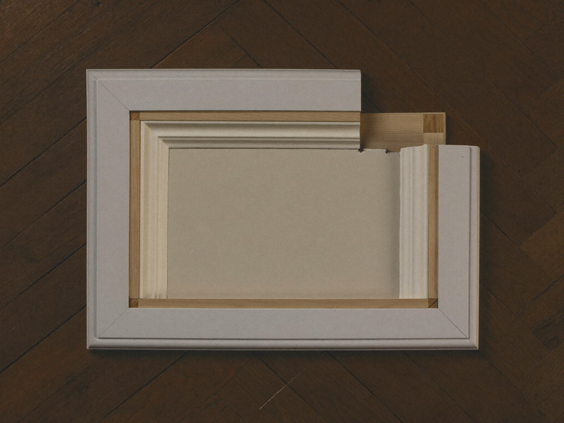 New baseboard and quarter-round scribed to an original oak floor — illustrative repair imagery