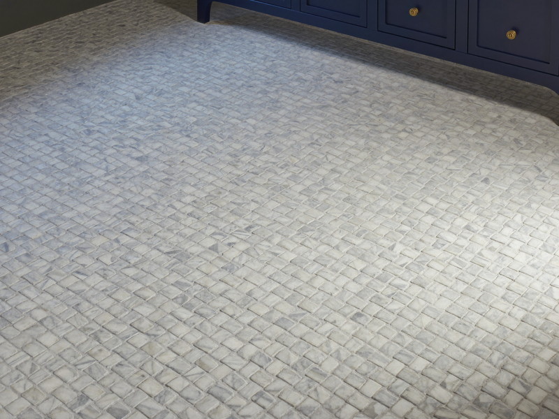 Classic white marble basketweave mosaic floor tile with soft gray dots in a renovated colonial bathroom, plain field tile only, every piece flat and even, foot