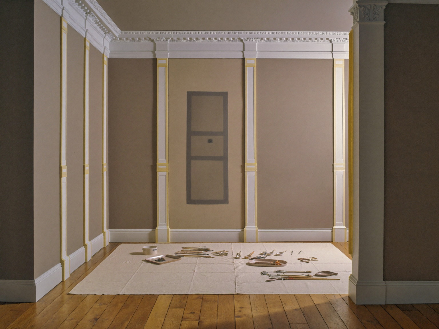 Careful interior painting preparation in a classic colonial: clean canvas drop cloths over oak floors, crown molding and tall casings masked with plain tape